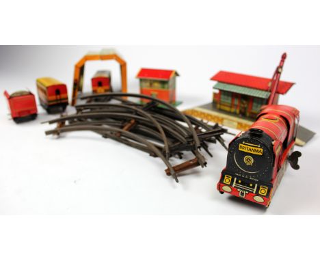 Brimtoy 'Britannia' clockwork tinplate train set with track, station etc., contained in original box (worn)