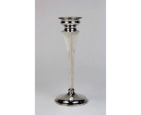 Silver candlestick of tapered design on circular weighted base, height approx 19.5cm, hallmarked Birmingham 1927 by Henry Wil