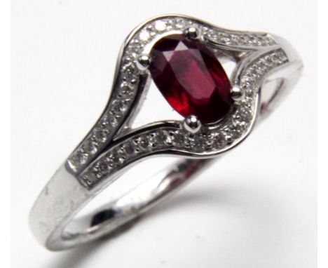 18ct White Gold Ring set with Ruby 0.73 ct weight and Diamonds size N weight 3.8 grams