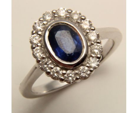 18ct White Gold Ring set with Sapphire 1.02 ct weight and Diamonds 0.50 ct weight size K weight 4.7 grams