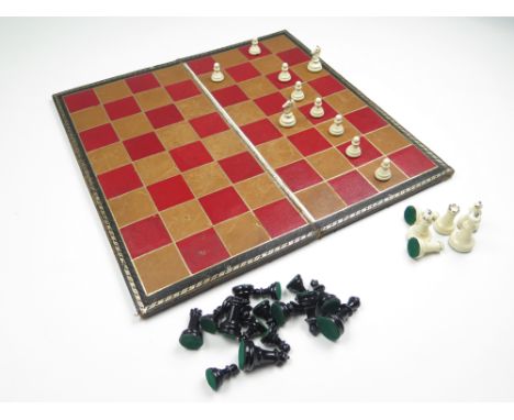 Complete set of thirty-two lead chess pieces with Spalding chess board