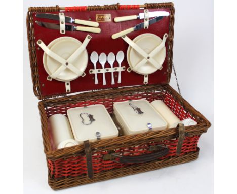 Coracle four placing picnic hamper, circa mid 20th century