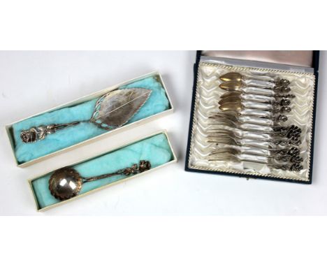 Set of twelve silver teaspoons and forks, each with a floral decorated handle, all stamped '800', contained in fitted case, t