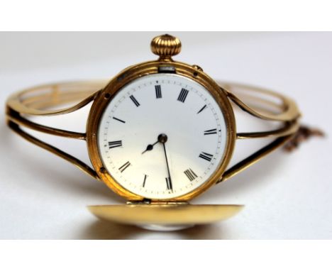 18ct gold ladies half hunter fob watch engraved on back "1882 - 1907" on a 18ct (tested) bangle style bracelet. Total weight 