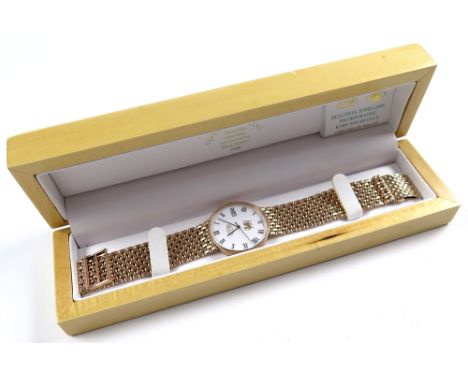 In its original box, midsize 9ct rose gold wristwatch "Cymru-Y-Metel" on a rose gold gate-link bracelet. Total weight 56.6g