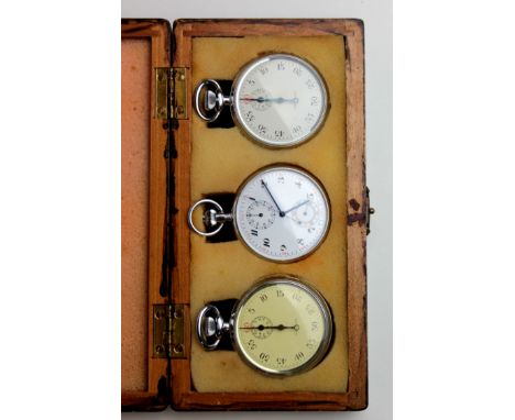 Three stopwatches with two being Walthams and having arrow marks on the back