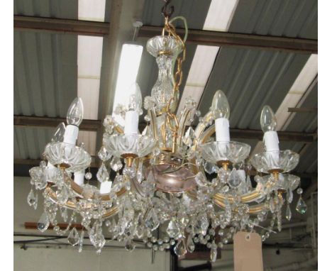 CHANDELIER, 20th century with ten glass clad lighting arms hung with glass drops and pendant chains, approximately 48cm H x 6