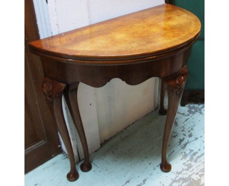 ARTHUR BRETT DEMI LUNE CARD TABLE, 18th century style walnut on cabriole legs with purple baize lining, 87cm x 78cm H x 43cm.