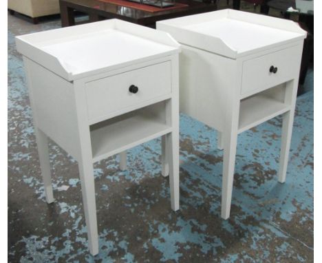 BEDSIDE TABLES, a pair, galleried tops above single drawer and open shelf on tapering legs in white finish, 47cm x 80cm H. (2