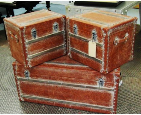 STEAMER TRUNK, in brown leather, 100cm x 45cm x 46cm H, plus a pair of smaller matching trunks, 46cm x 39cm x 40cm H. (3)