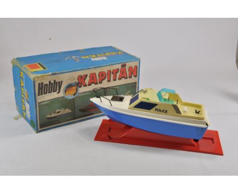 An unusual large scale plastic battery operated Hobby Kapitan Police Boat. Generally Fair Plus to good with Fair Box.