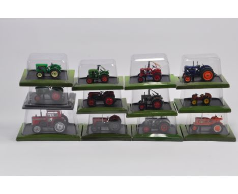 12 x Hatchette Tractor Models in 1/43 Scale made by Universal Hobbies. Includes Fordson E27N, MF590, MF65 and others. 12 in t