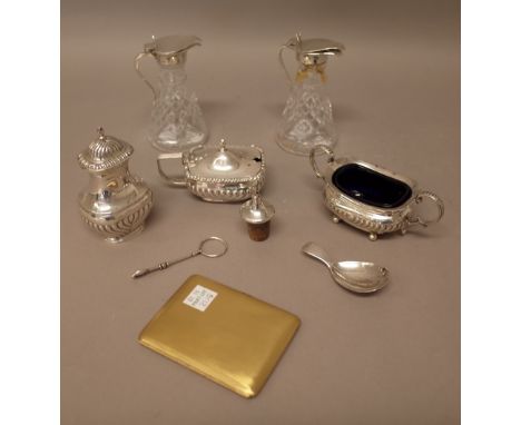 Silver and silver mounted wares, comprising; a tea caddy spoon, probably London 1814, a mustard pot, a pepperette and a salt,