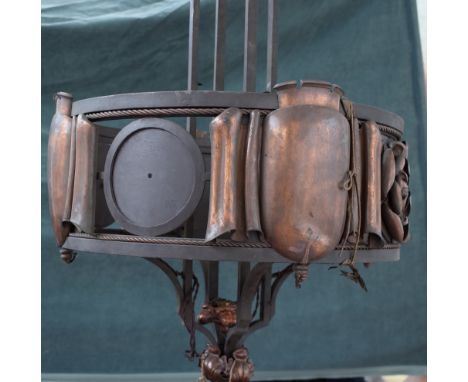 A steel, copper mounted chandelier, early 20th century, of circular form, the plates of scroll form, interspersed with Tudric