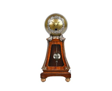 An unusual German Arts & Crafts style mantel clock, the bronzed globular case with applied numbers suspending a globular pend