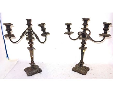 A pair of silver plated three light table candelabra, 47cm tall (2).  I6