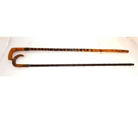 A bamboo and horn handled walking stick with silver mount together with another similar.   CAB