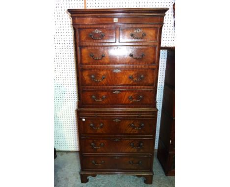 A 20th century mahogany chest on chest with two short over six long drawers on bracket feet, 70cm wide x 148cm high.  M5