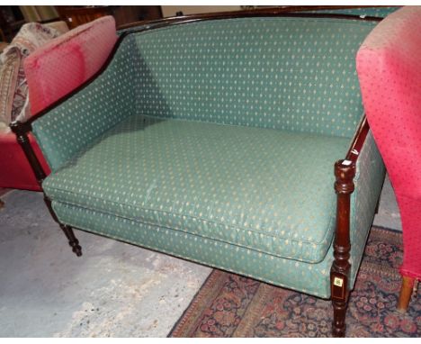 A Regency style mahogany show frame sofa with downswept arms and turned supports, 126cm wide x 85cm high.  BAY 2