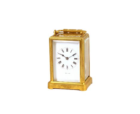 A French brass cased carriage clock, late 19th century, the white enamel dial detailed 'Drocourt', with visible escapement an