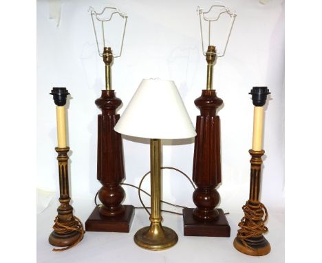 A pair of 20th century mahogany table lamps on reeded tapering columns, 60cm high, another pair of 20th century fluted lamps,