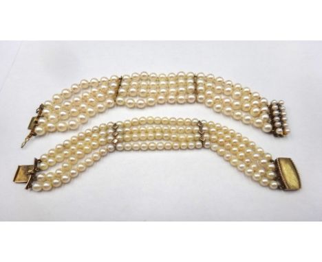 A four row bracelet of uniform cultured pearls, on a gold, sapphire and cultured pearl snap clasp, detailed 14 K, length 19cm