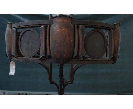 A steel, copper mounted chandelier, early 20th century, of circular form, the plates of scroll form, interspersed with Tudric