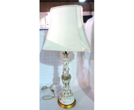 A 20th century porcelain lamp base moulded with flowers and leaves, 60cm high.   E7
