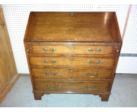 A 19th century oak bureau with fitted interior on bracket feet, 89cm wide x 99cm high.   F8
