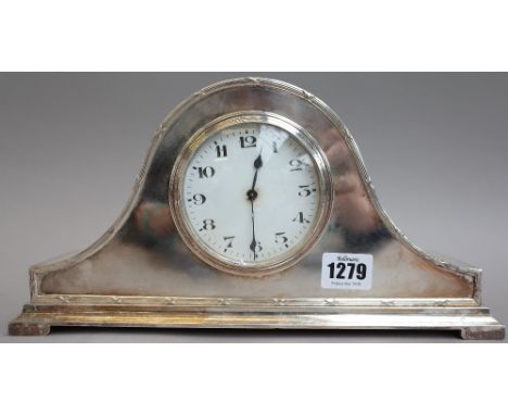 An Edwardian silver plated arch top mantel clock with white enamel dial, 16cm high, a small Lalique style frosted glass mante