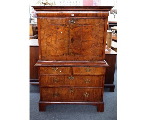 A William and Mary figured walnut secretaire chest, with flush fit upper drawer over full front (interior lacking) with two s