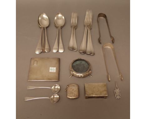 Silver, comprising; two pairs of sugar tongs, a pair of salt spoons, London 1829, a rectangular cigarette case, with engine t