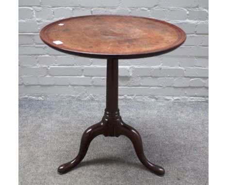 A mid-18th century mahogany occasional table, the dished circular one piece top on a tripod base, 55cm diameter x 68cm high. 