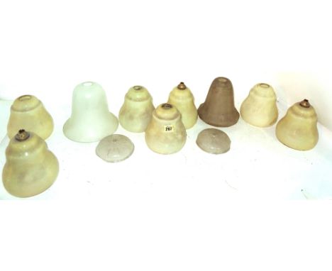 A large quantity of mostly 20th century frosted and green glass lamp shades of varying size, (qty).  S4T