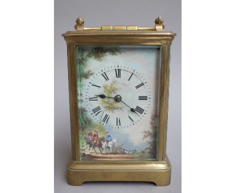 An early 20th century cased carriage clock, with visible escapement and single train movement concealed by a painted porcelai