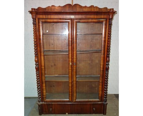 A Victorian rosewood bookcase with single drawer to base flanked by bobbin turned column, 112cm wide x 105cm high.  B10