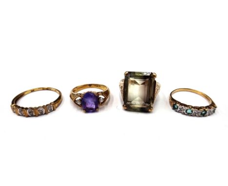 A 9ct gold, emerald and diamond set seven stone half hoop ring, a 9ct gold ring, claw set with an oval cut amethyst between t