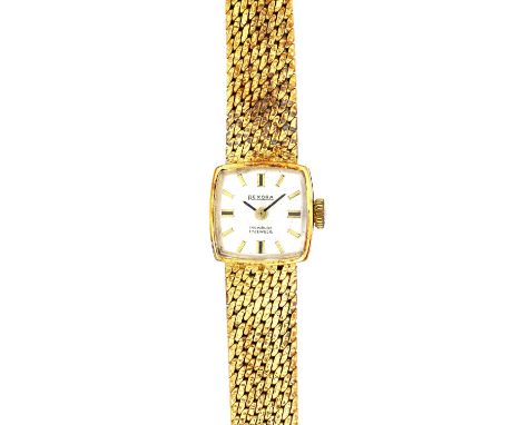 A Rexora gold lady's bracelet wristwatch, the signed curved square silvered dial with baton shaped numerals, on a textured wo