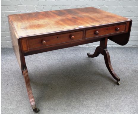 A George III mahogany sofa table with pair of frieze drawers and dummy opposing on four downswept supports, 99cm across x 154