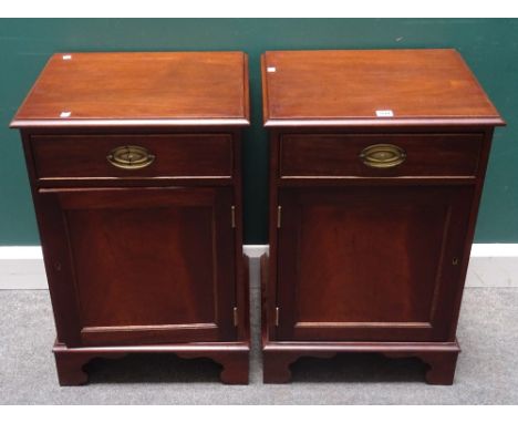 A pair of George III style mahogany bedside tables, each with single drawer over cupboard, on bracket feet, 49cm wide x 74cm 