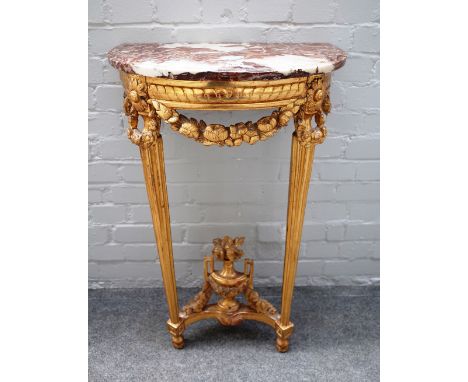 A mid-19th century French console table, the 'D' shape marble top on a gilt floral mounted base of two tapering fluted suppor