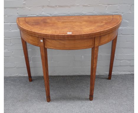 A George III mahogany banded satinwood semi-elliptic card table, on tapering square supports, 100cm wide x 74cm high x 45cm d