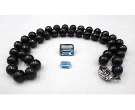 A single row necklace of black tinted freshwater cultured pearls, on a white gold and diamond set oval clasp, detailed 585, l