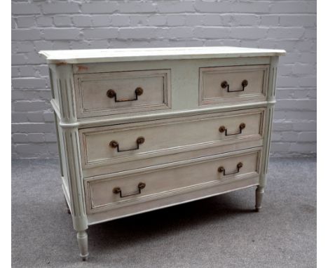 A pale green painted Louis XVI style commode, with two short over two long drawers flanked by fluted rounded corners, on turn