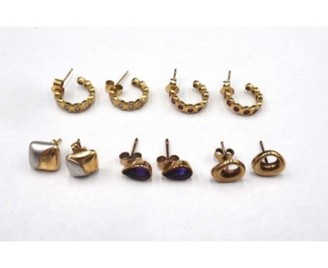 A pair of gold earstuds, each in a pierced openwork design, a pair of 9ct two colour gold earstuds, each in a curved square d