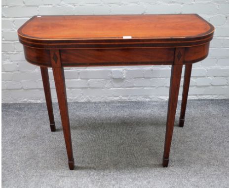 A late George III inlaid mahogany 'D' shaped card table, on tapering square supports, 89cm wide x 73cm high x 44cm deep.