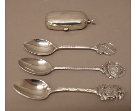 A silver twin compartment sovereign case, decorated with engine turned bands, Birmingham 1911 and 1910 and three silver spoon