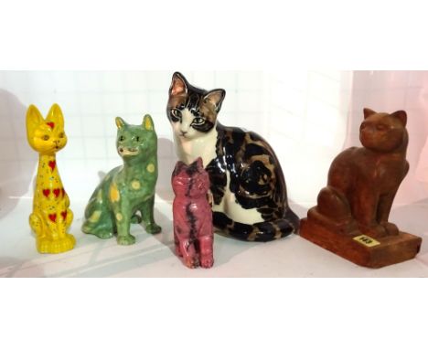 Collectables, including; a Galle style cat, a carved wooden cat and three other ceramic cats, (5).   S3M
