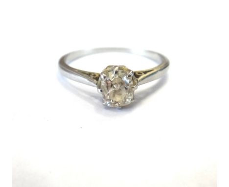 A platinum and diamond single stone ring, claw set with a cushion shaped diamond, ring size K.