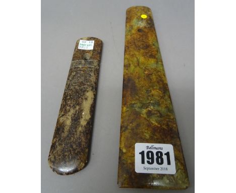 A Chinese jade axe blade or chisel, the stone of celadon, russet and cream tone, 24.5cm.length; and a jade blade or rank badg